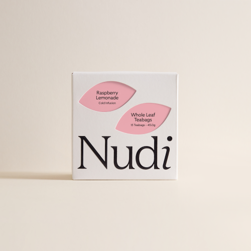 Nuditea raspberry lemonade luxury tea box featuring two pink leaf labels on a white box.